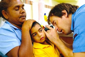 dr checking the inner ear of a child